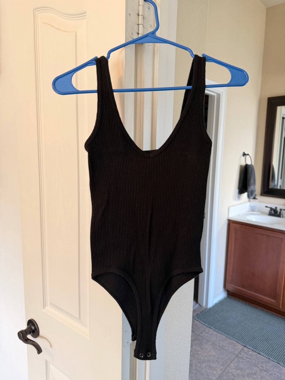 Black Ribbed One-Piece Bodysuit